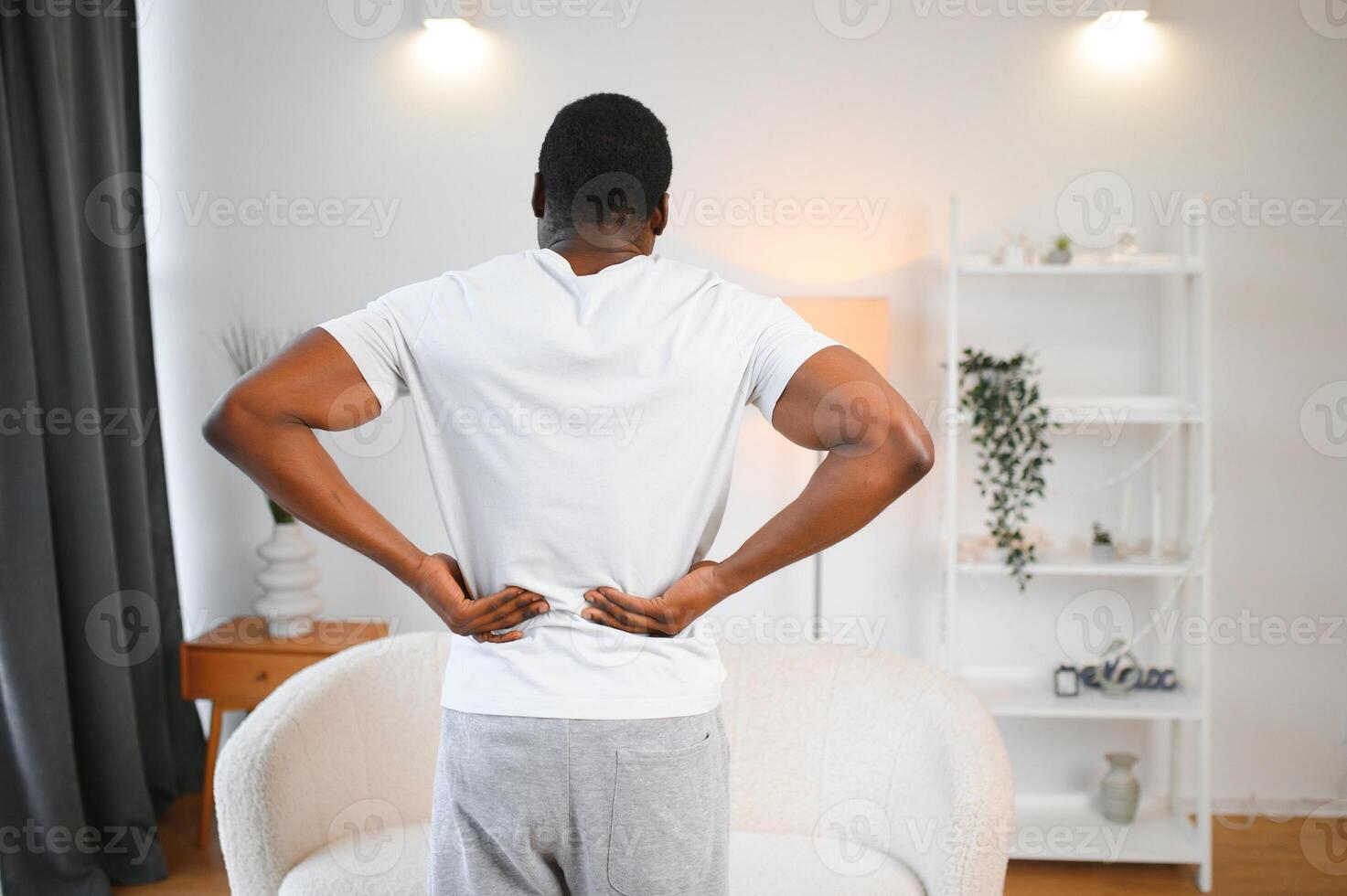 Young African Man Having Back Pain photo