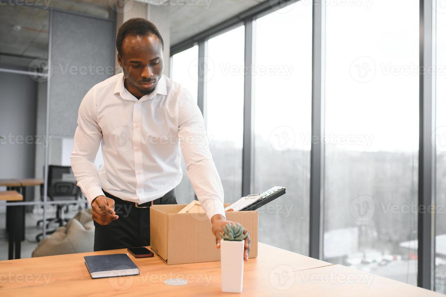 Portrait of african american employee being fired. photo