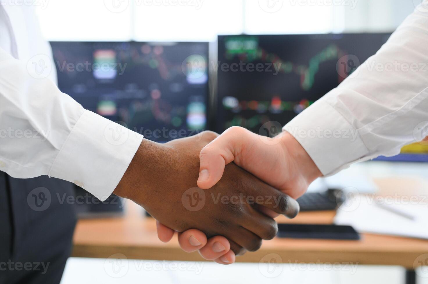 Investor stock trading of business partners shaking hands against screen for cooperating of investing agreement of highest valued technology product trending on the dynamic market stock. Sellable photo