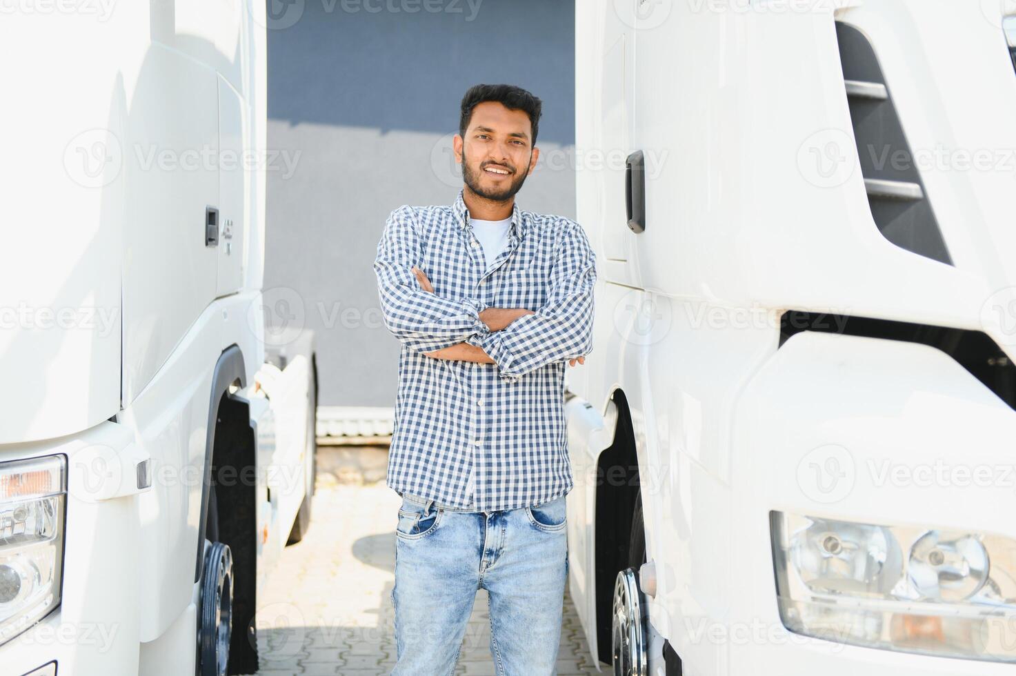 Young Indian truck driver. Concept of road freight transportation. photo