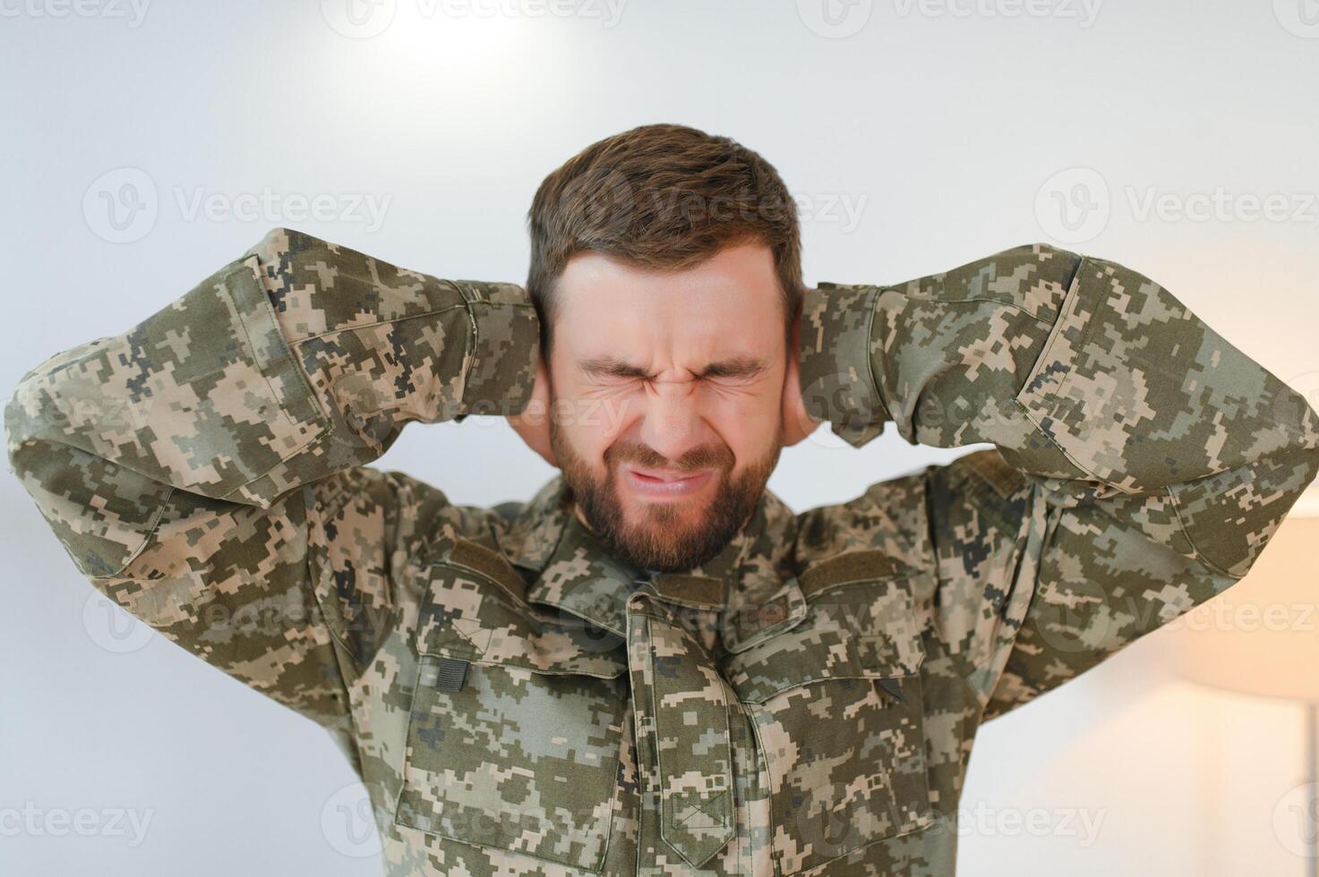 Military veteran with post traumatic stress disorder screaming at home photo