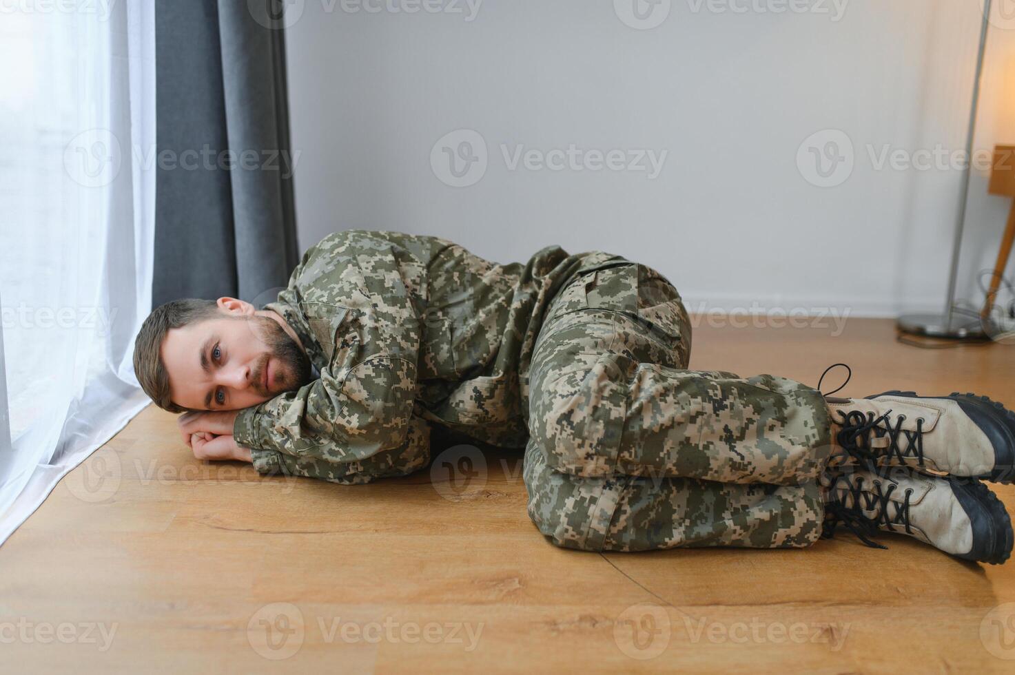 Depressed man recalling war days. Portrait of veteran soldier who has PTSD photo