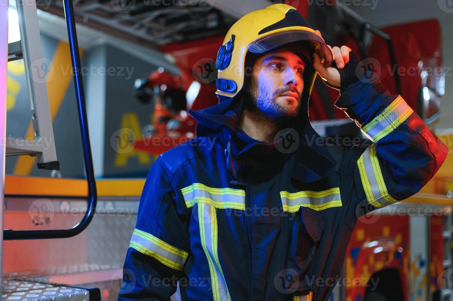 Photo of fireman with gas mask and helmet near fire engine