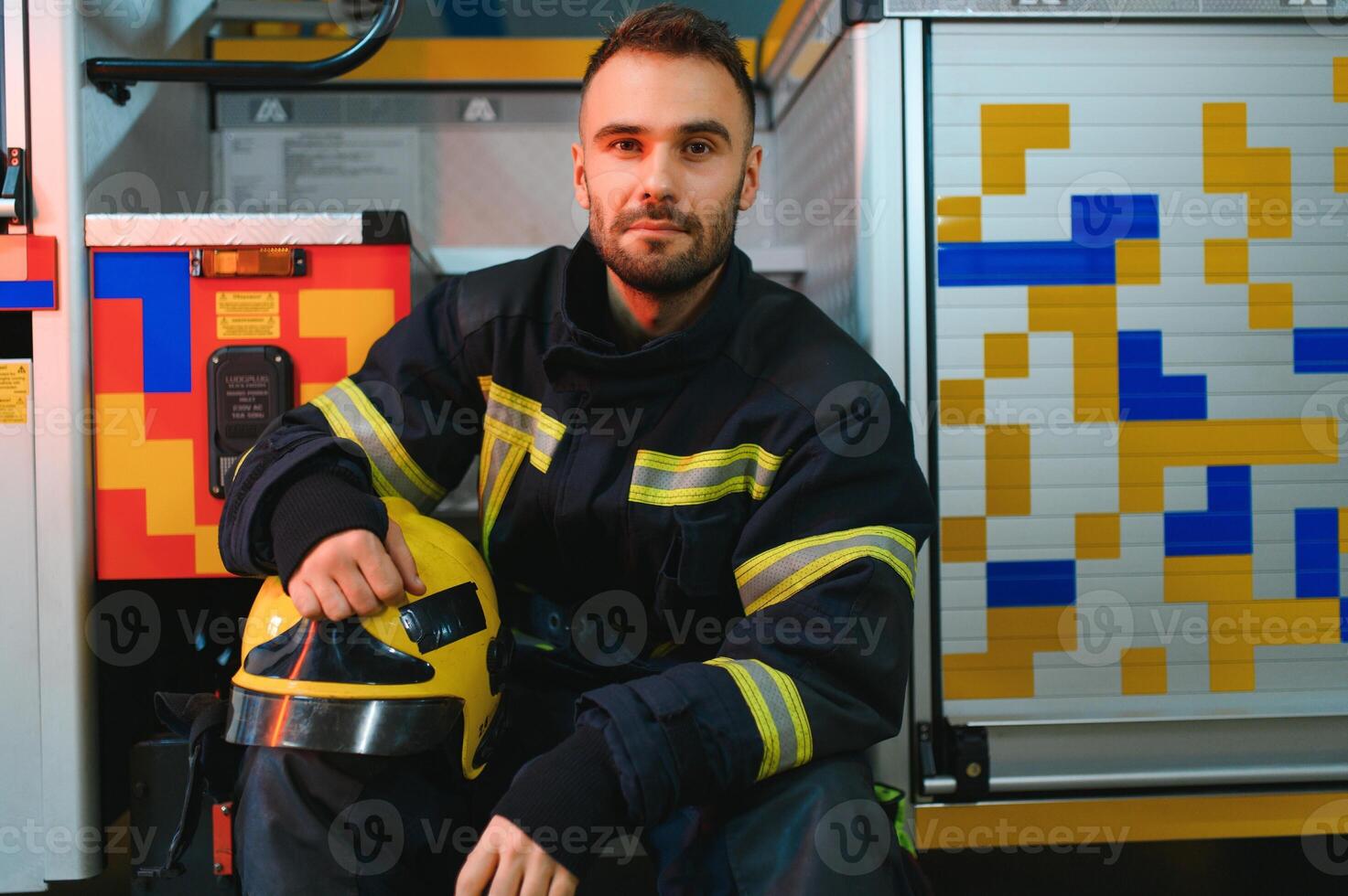 Photo of fireman with gas mask and helmet near fire engine