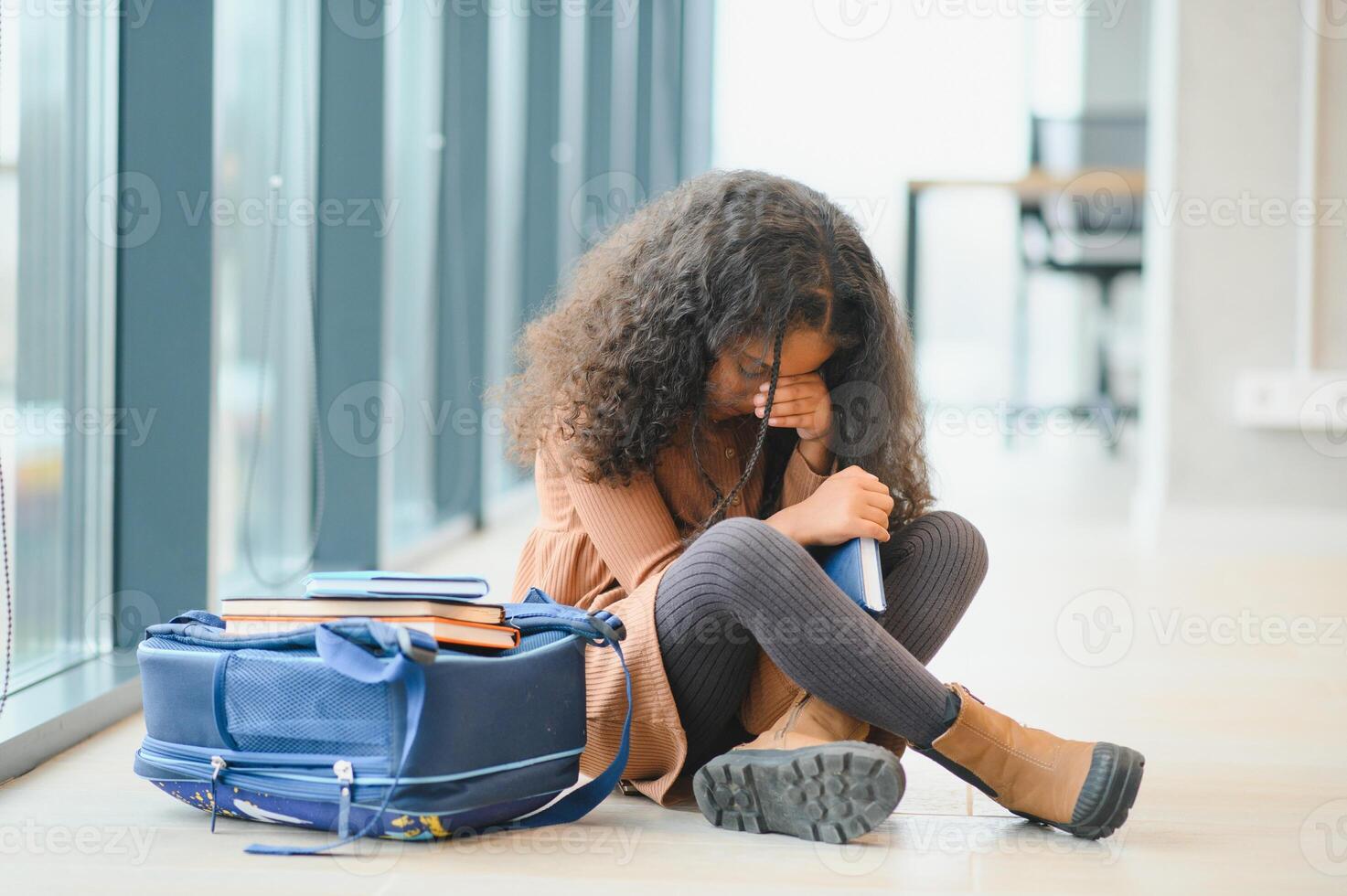 Pupils bullying African-American girl at school. Stop racism photo