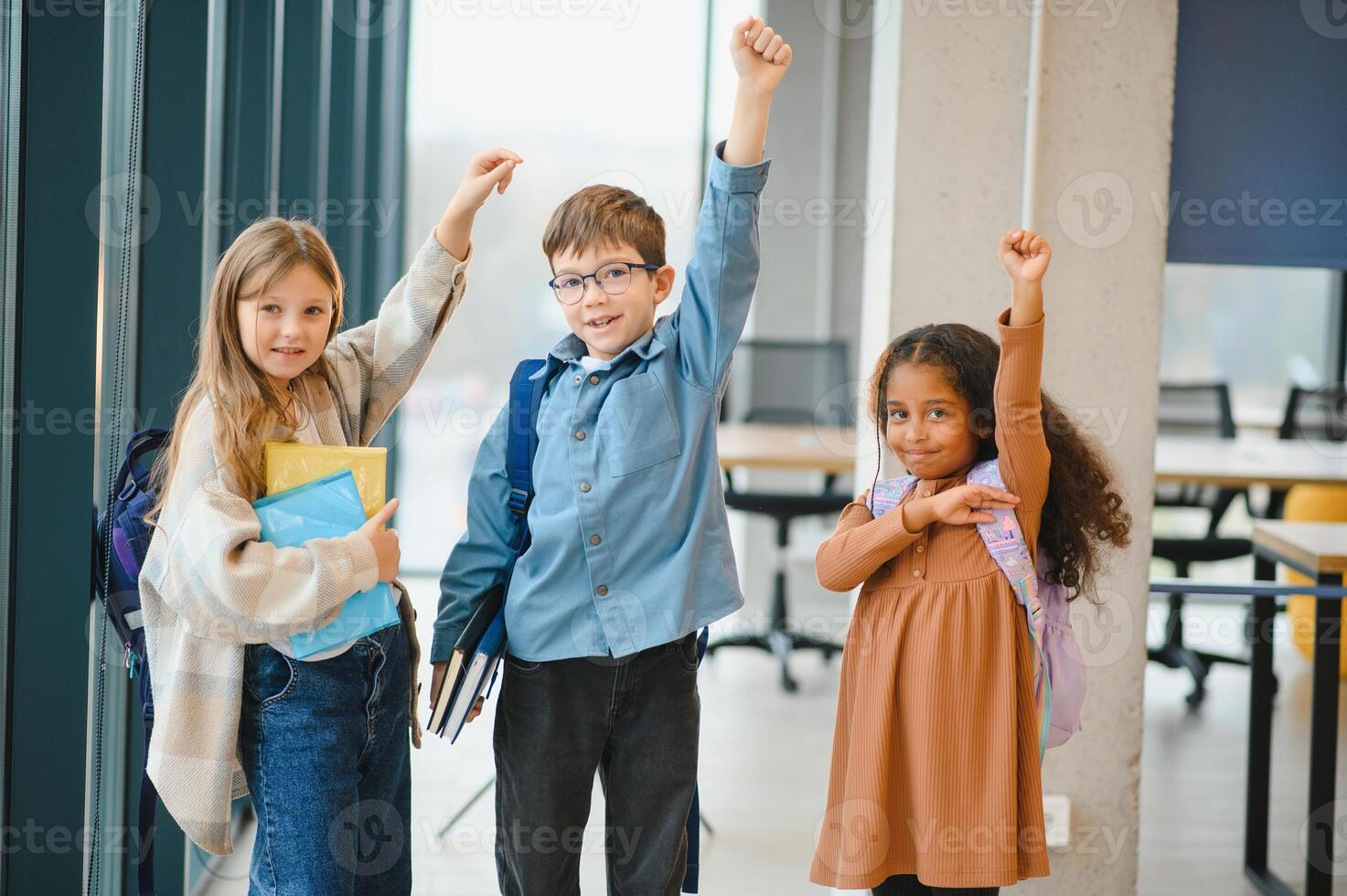 Group of elementary school kids in a school corridor photo