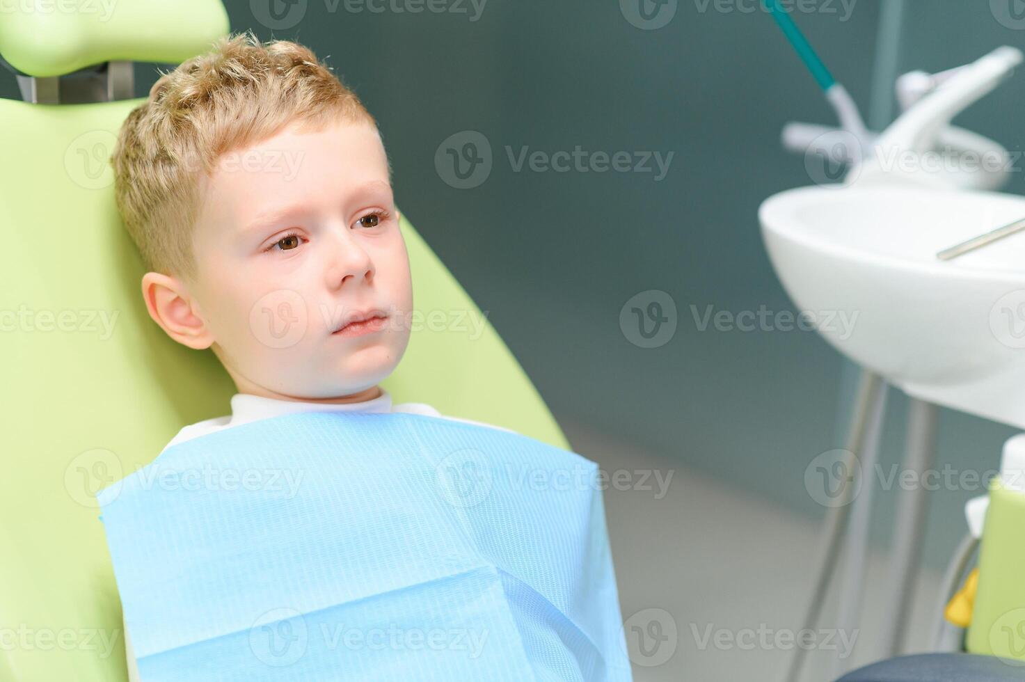 Crying and screaming little boy at the dentist photo