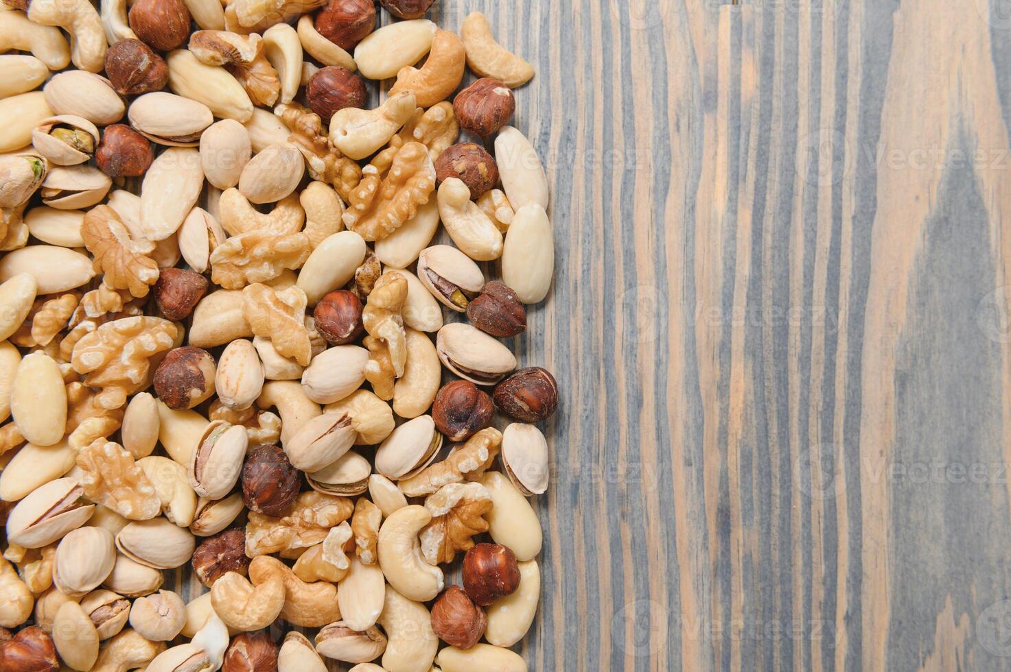 mix nuts on a wooden table photo
