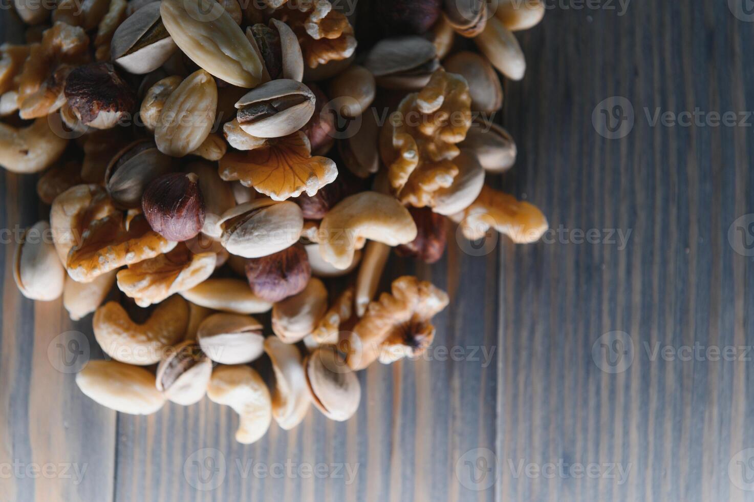 mix nuts on a wooden table photo