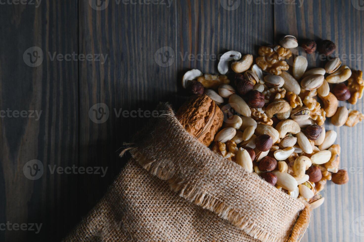 mix nuts on a wooden table photo