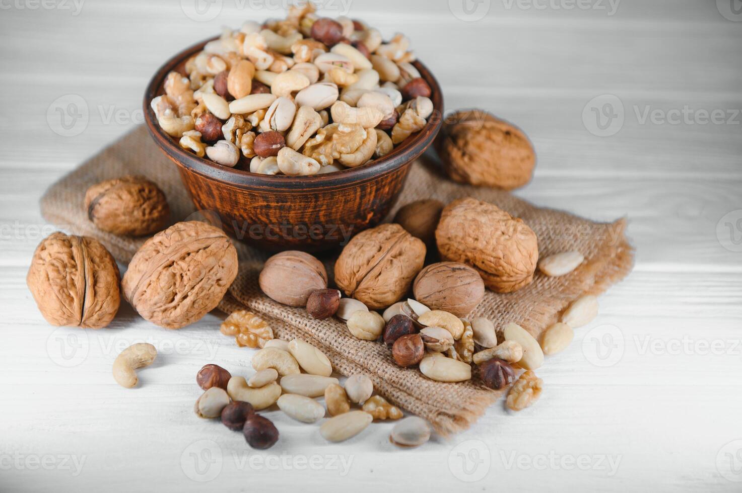Mixed nuts on a plate. White background photo