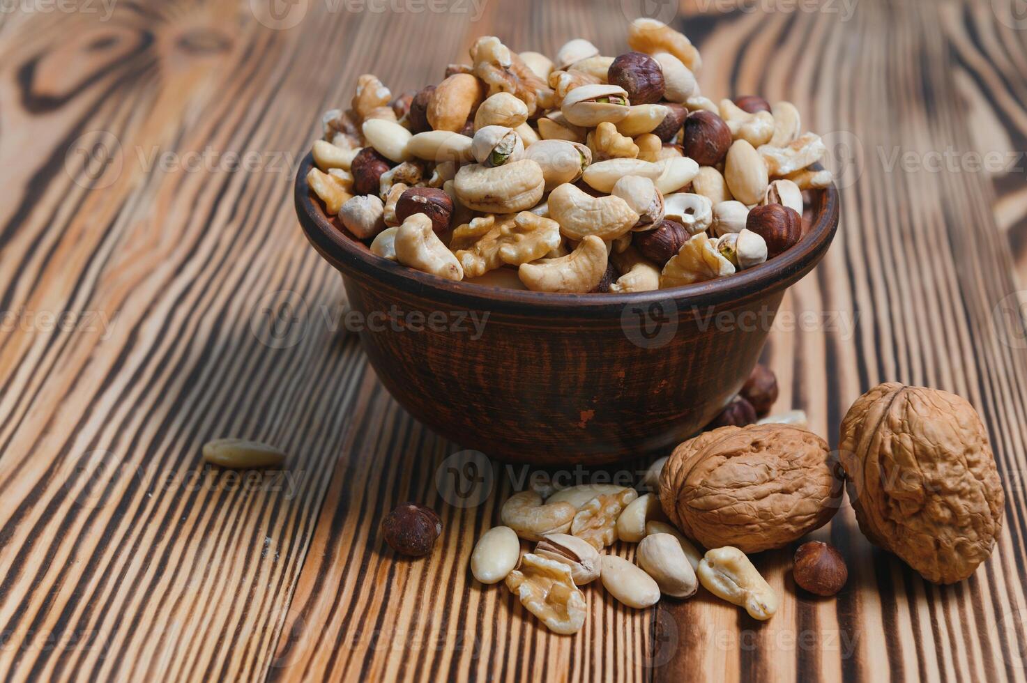 mix nuts on a wooden table photo