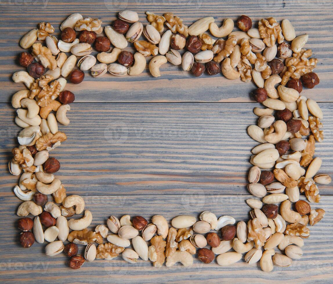 mix nuts on a wooden table photo