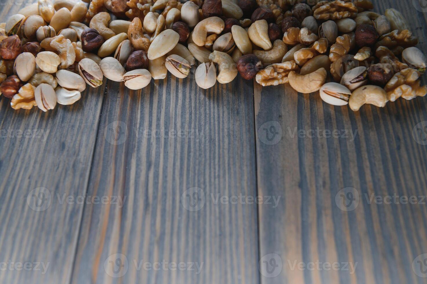 mix nuts on a wooden table photo