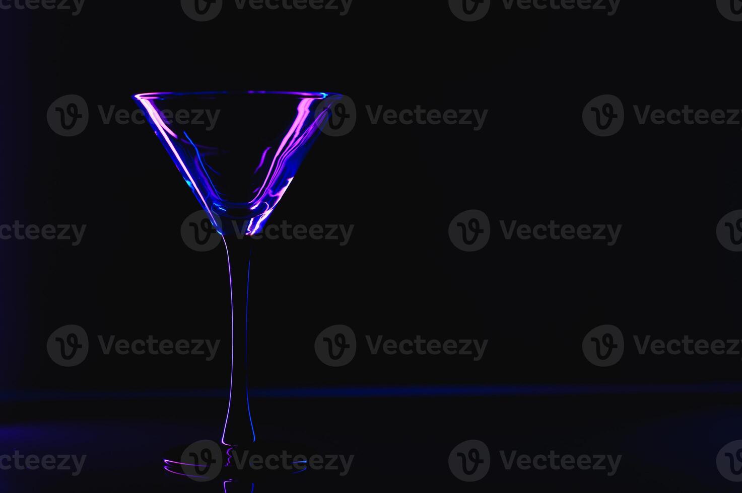 silhouette of martini glass on black background photo