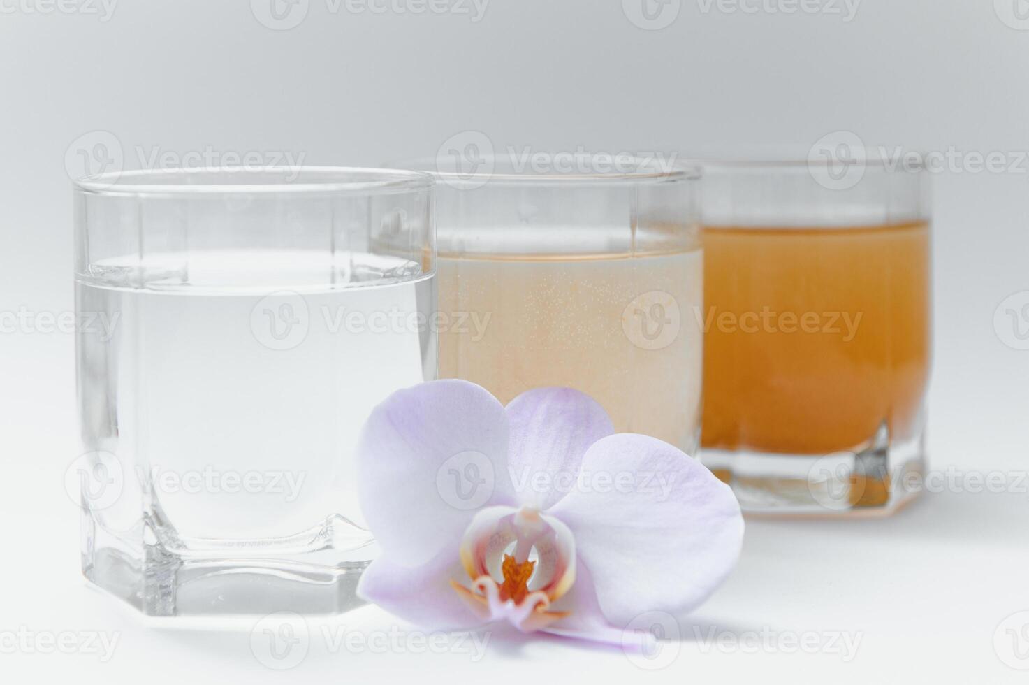 Water filters. Concept of three glasses on a white background. Household filtration system. photo