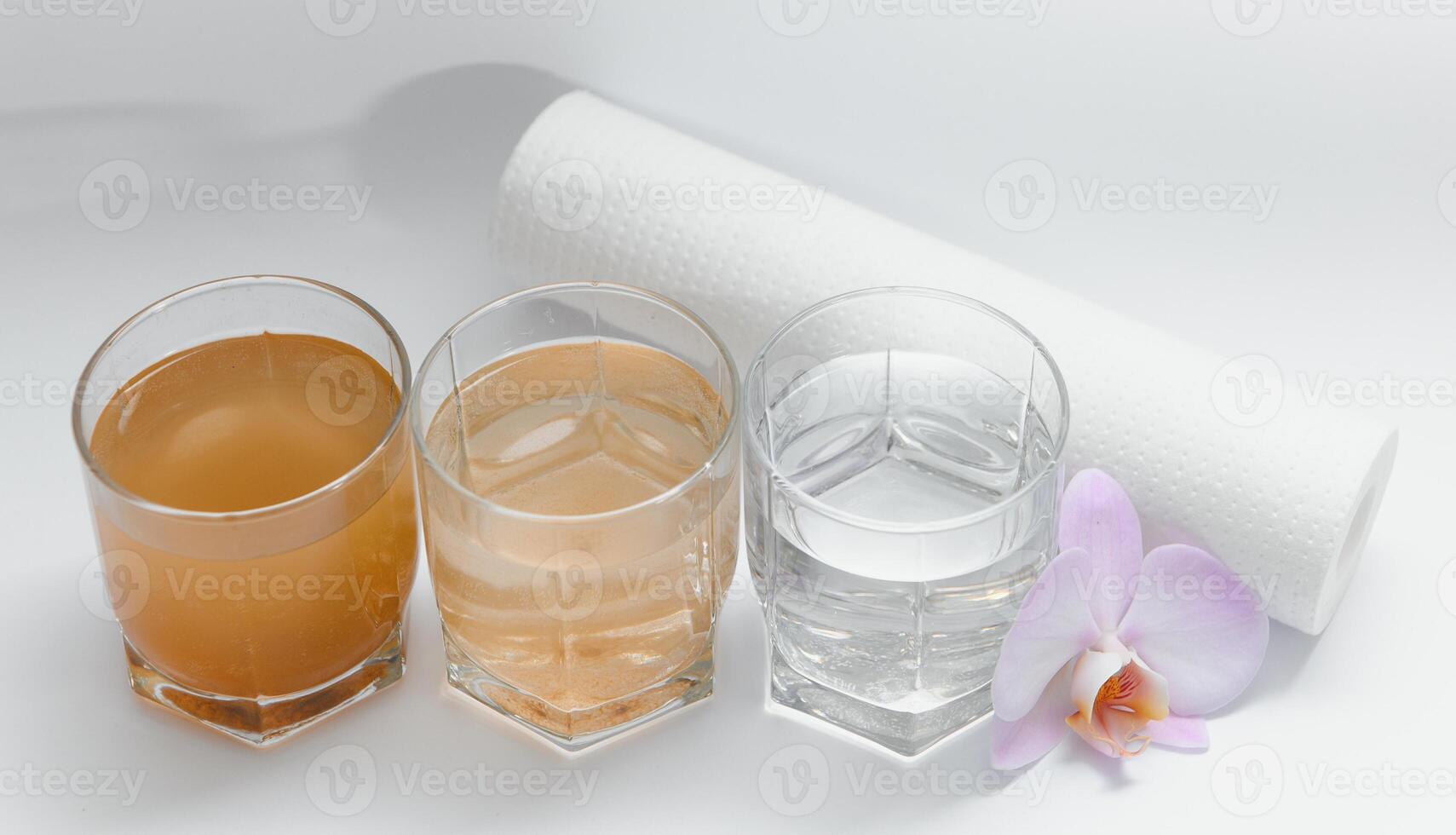 close up glasses with clean and dirty water. concept of water pollution. photo