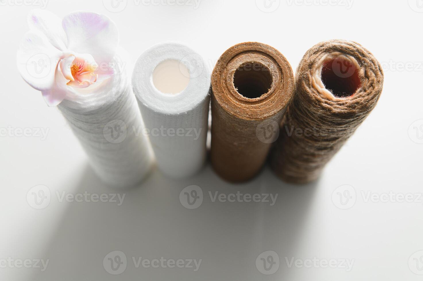 used water filters, glasses with dirty water photo