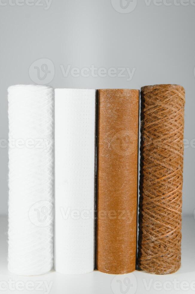 used water filters, glasses with dirty water photo