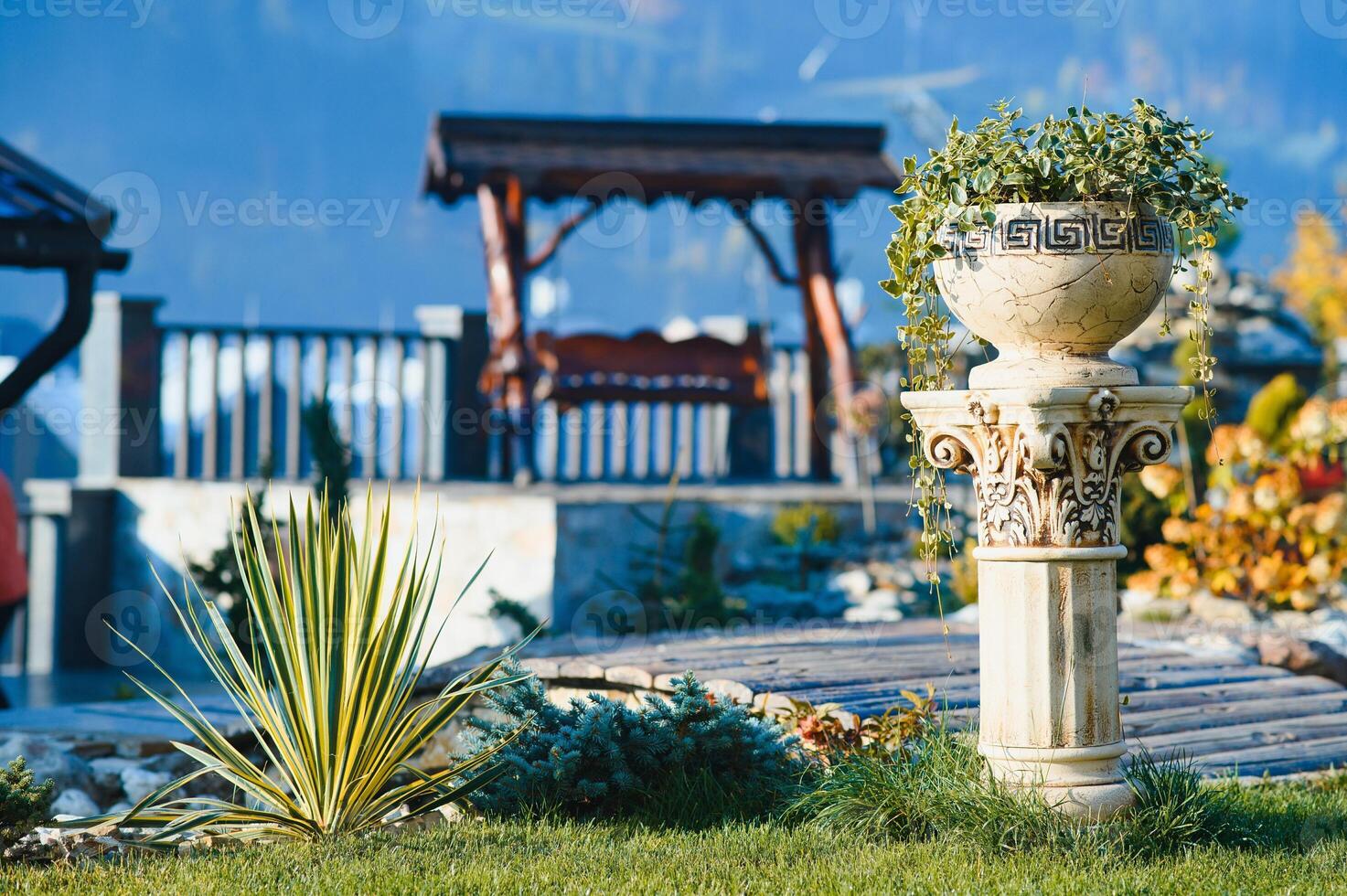 Backyard Garden Modern Design Landscaping. Landscaped Back Yard. Decorative Garden With Pathway Or Walkway From Stone And Rocks Or Gravel. Back Yard Or Park Lawn With Stony Natural landscaping. photo