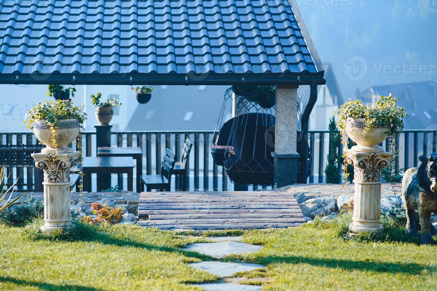 Backyard Garden Modern Design Landscaping. Landscaped Back Yard. Decorative Garden With Pathway Or Walkway From Stone And Rocks Or Gravel. Back Yard Or Park Lawn With Stony Natural landscaping. photo