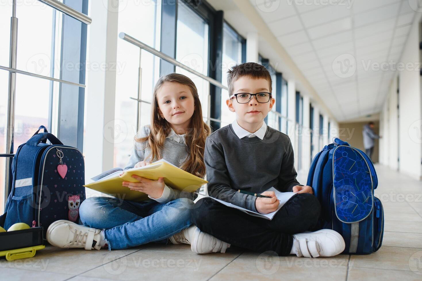 School kids in uniform together in corridor. Conception of education photo