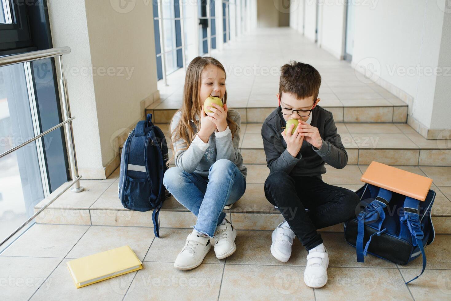 School kids in uniform together in corridor. Conception of education photo