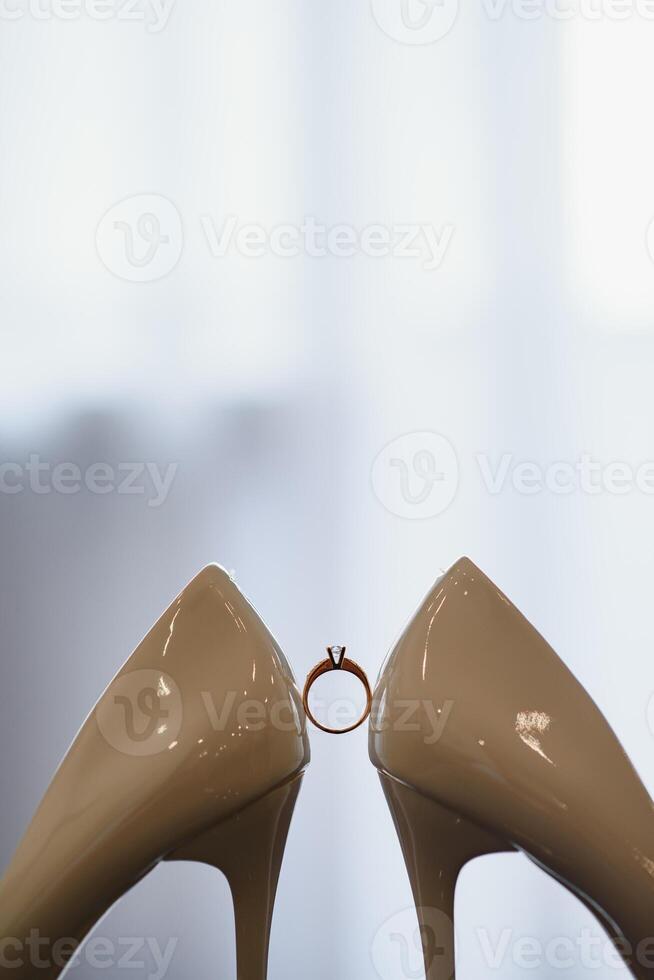 Wedding rings and high heels photo