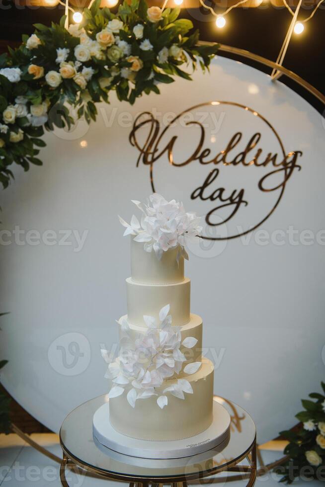 Elegant wedding cake with flowers and succulents photo