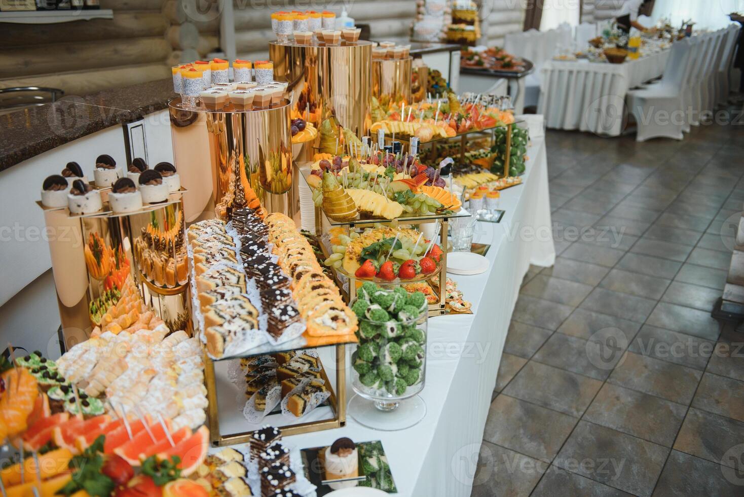 various dessert with fresh fruit on buffet line, sweet. photo