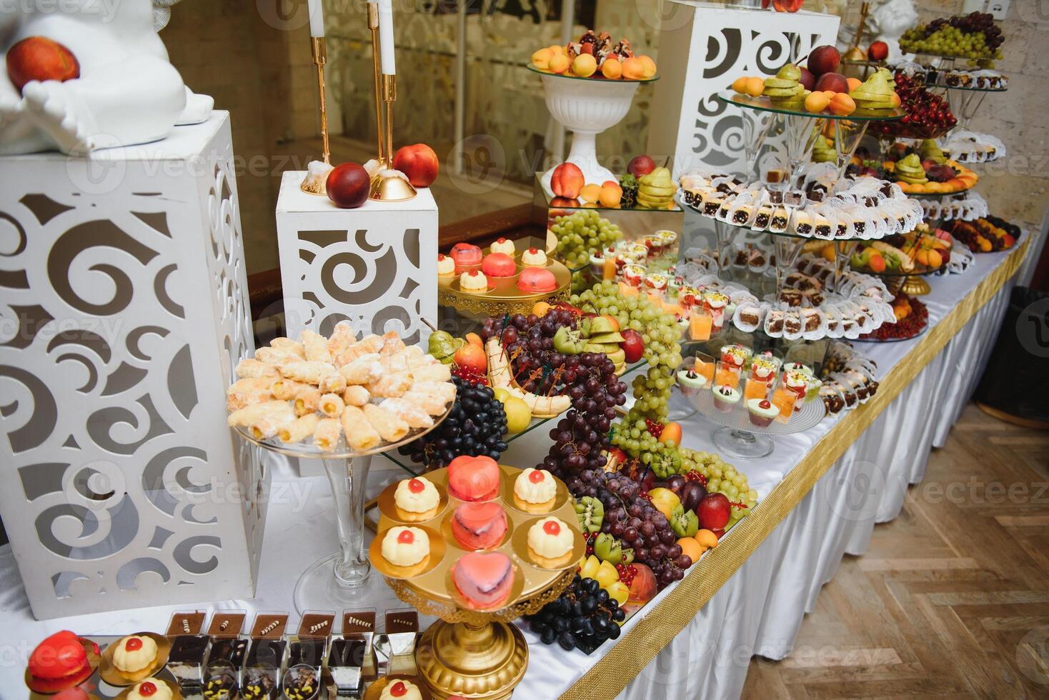 various dessert with fresh fruit on buffet line, sweet. photo