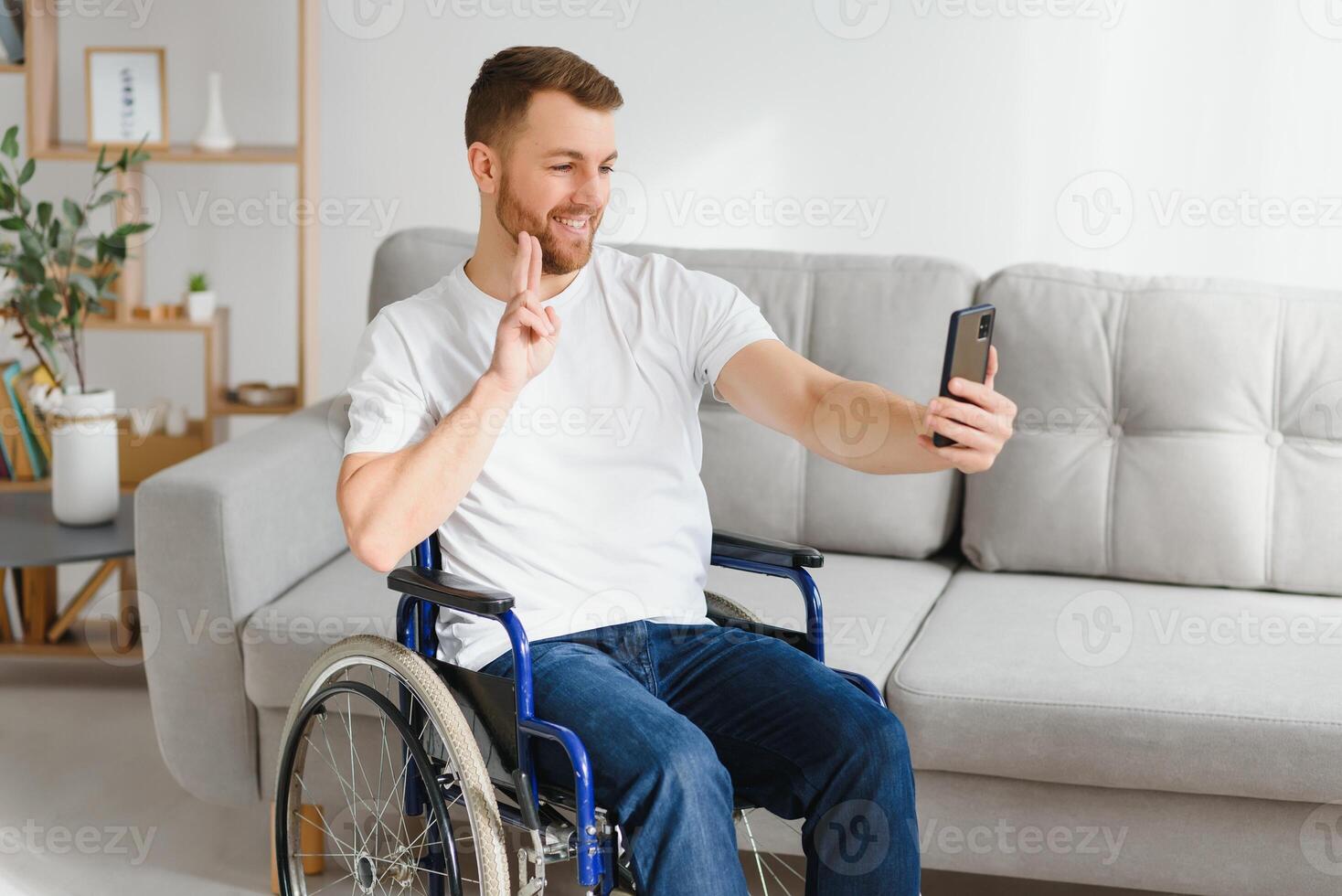 Young handsome man in wheelchair photo