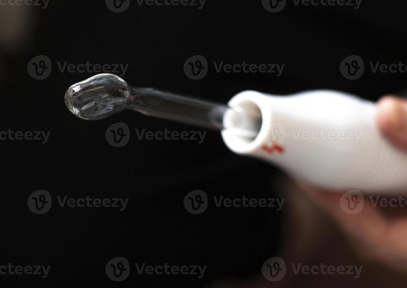 Close up shot of the high frequency comb tool for hair, scalp and skin treatment. Healthcare photo