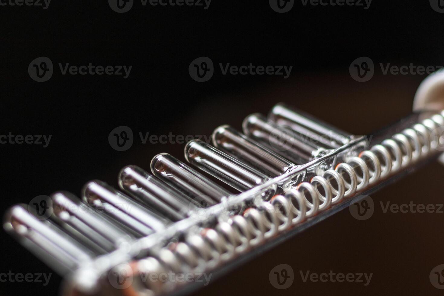 Close up shot of the high frequency comb tool for hair and scalp treatment. Healthcare photo