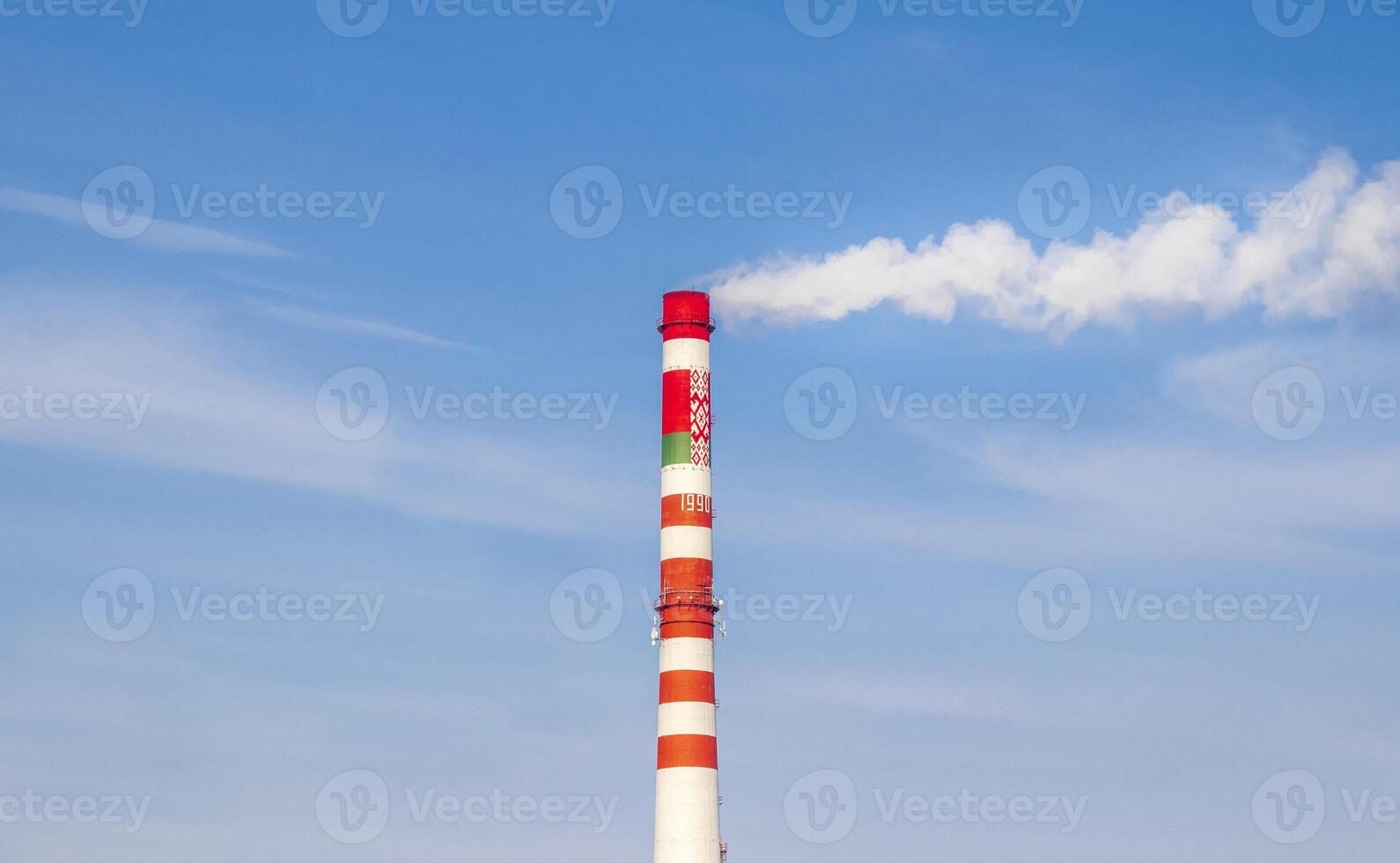 Shot of the smoke from the chimney of the heating station. City photo