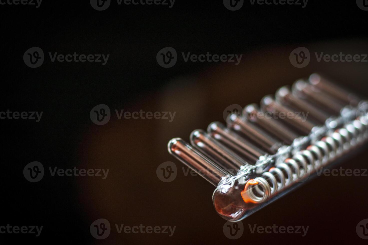 Close up shot of the high frequency comb tool for hair and scalp treatment. Healthcare photo