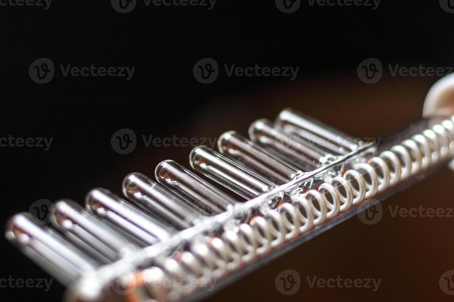 Close up shot of the high frequency comb tool for hair and scalp treatment. Healthcare photo