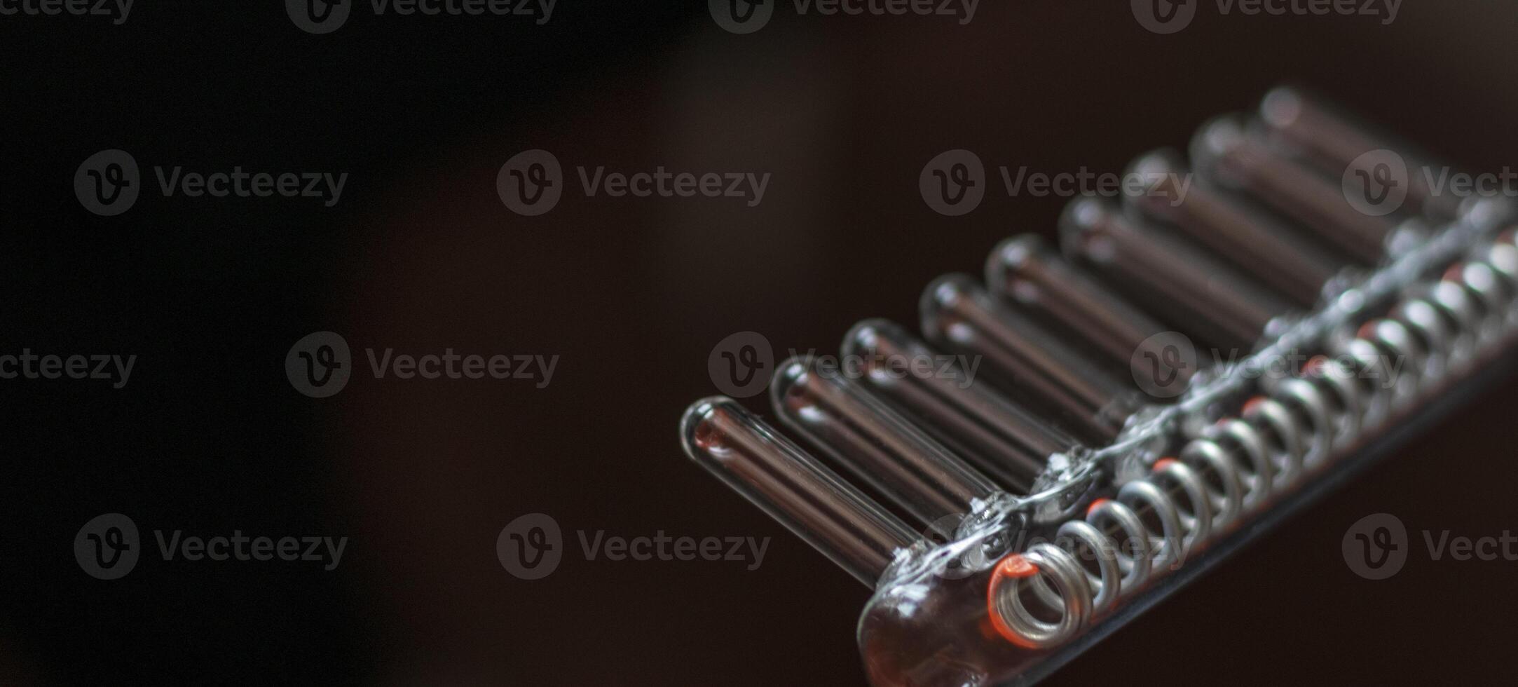 Close up shot of the high frequency comb tool for hair and scalp treatment. Healthcare photo