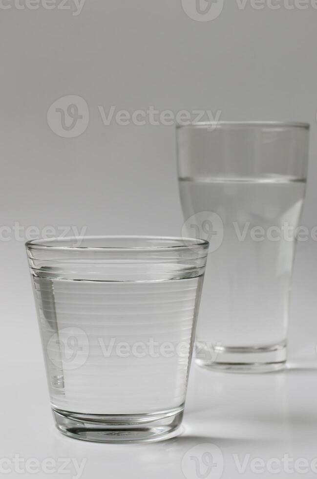 Glasses of Drinking Water on Clear Background photo