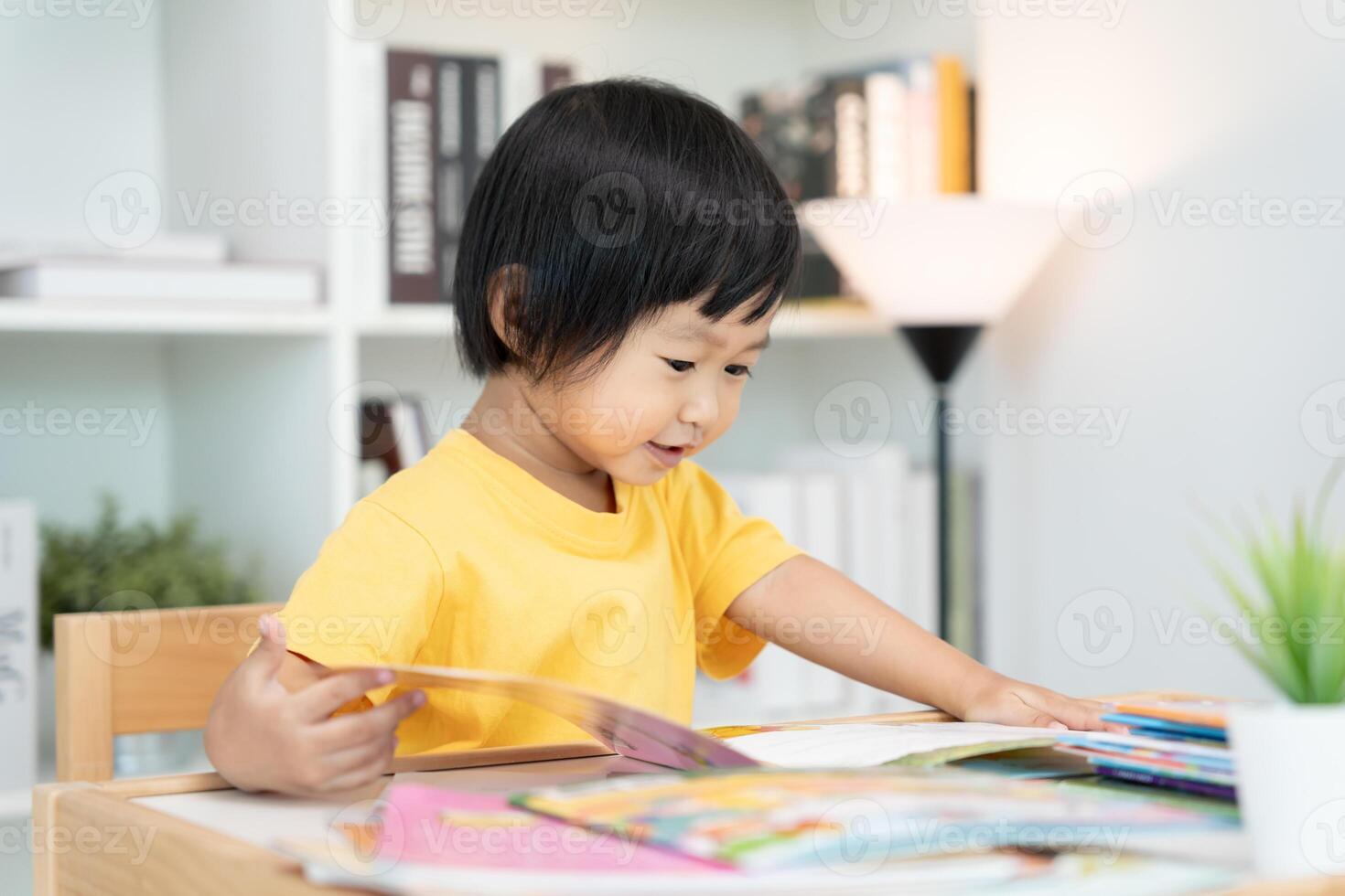 Happy Asian children relax read book at home. daughter and reading a story. learn development, childcare, laughing, education, storytelling, practice, imagine, reduce addiction mobile phone photo