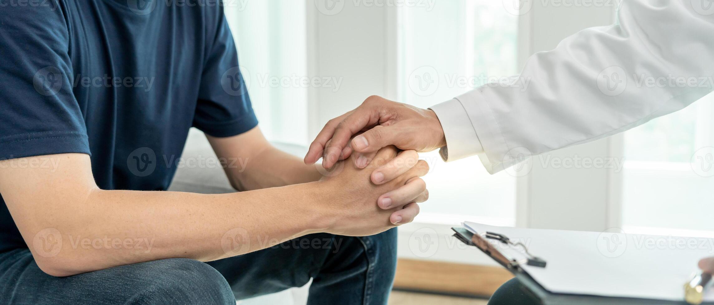 psychiatrist hold hand support each while discussing family issues. doctor encourages and empathy man suffers depression. psychological, save divorce, Hand in hand together, trust, care photo