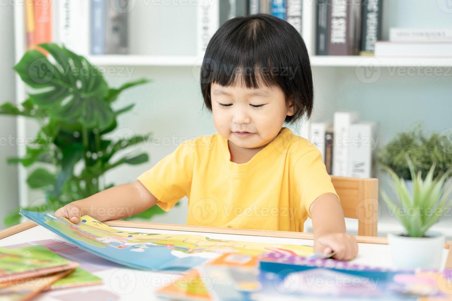 Happy Asian children relax read book at home. daughter and reading a story. learn development, childcare, laughing, education, storytelling, practice, imagine, reduce addiction mobile phone photo