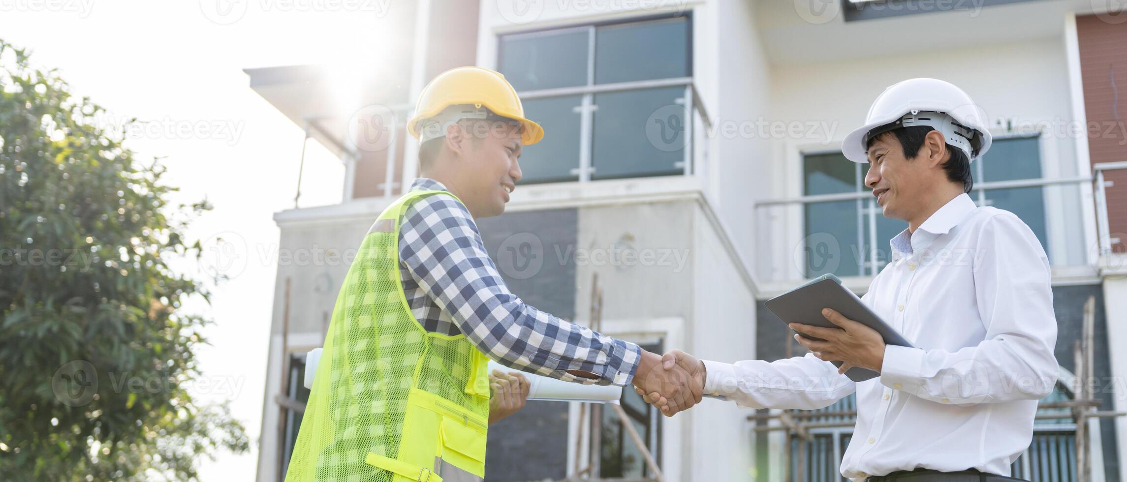 Construction team hands shaking greeting start up plan new project contract in office center at construction site, industry ,architecture, partner, teamwork, agreement, property, contacts. photo
