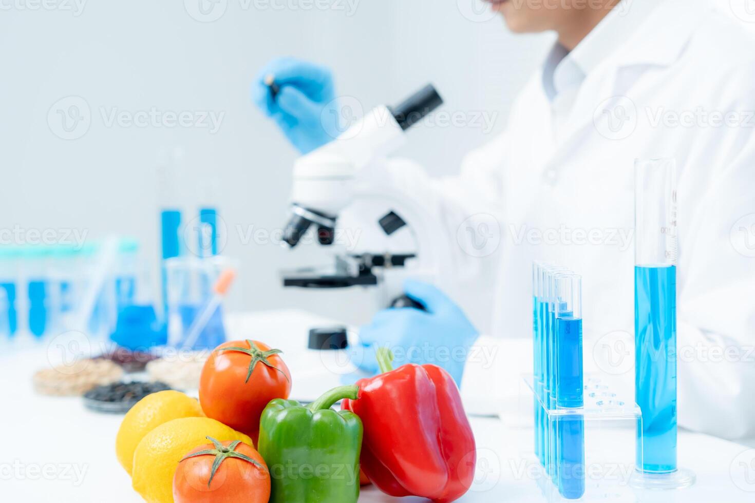 Scientist check chemical food residues in laboratory. Control experts inspect quality of fruits, vegetables. lab, hazards, ROHs, find prohibited substances, contaminate, Microscope, Microbiologist photo