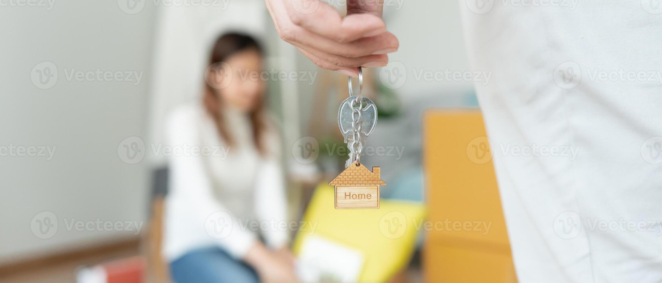 Moving house, relocation. Husband hold key house keychain in new apartment. move in new home. Buy or rent real estate. flat tenancy, leasehold property, new landlord, investment, dwelling, loan photo