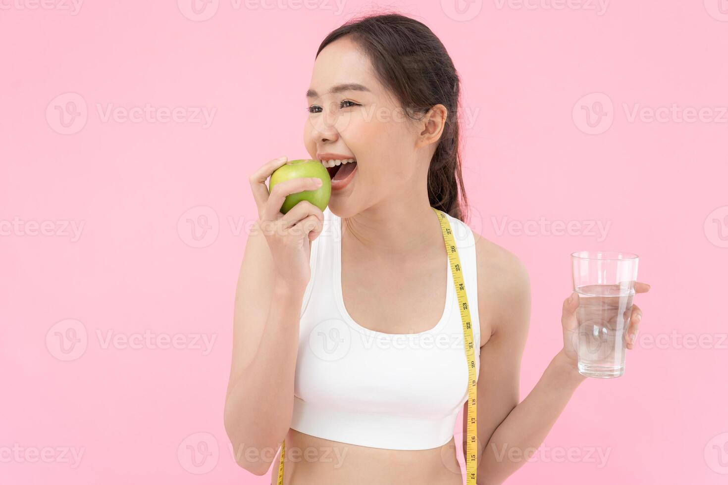slim body asian women choose healthy foods, dieting female choose green apple for diet. Good healthy food. weight lose, balance, control, reduce fat, low calories, routines, exercise, body shape. photo