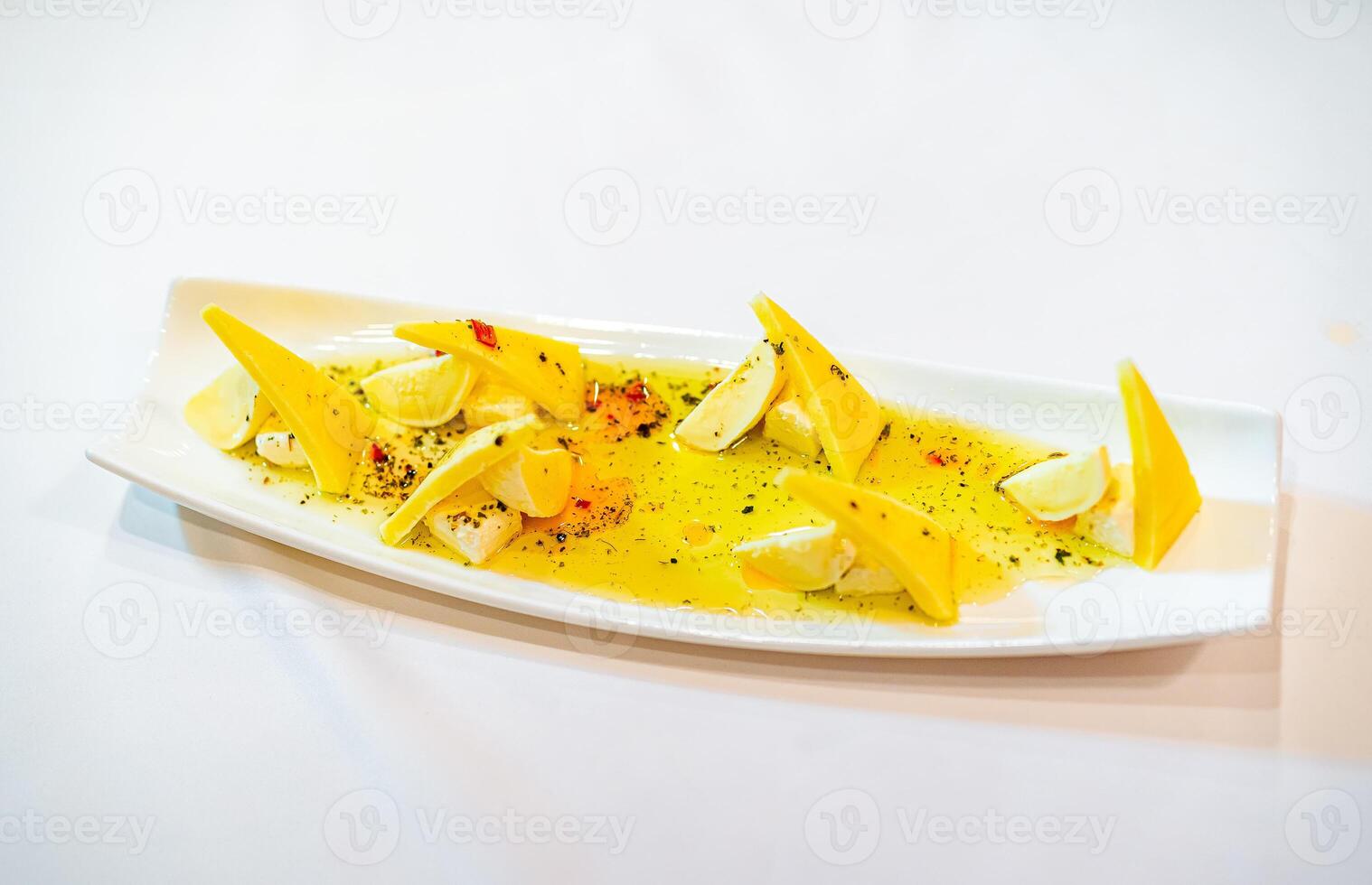 A Plate of Freshly Sliced Bananas. A white plate topped with sliced up bananas photo
