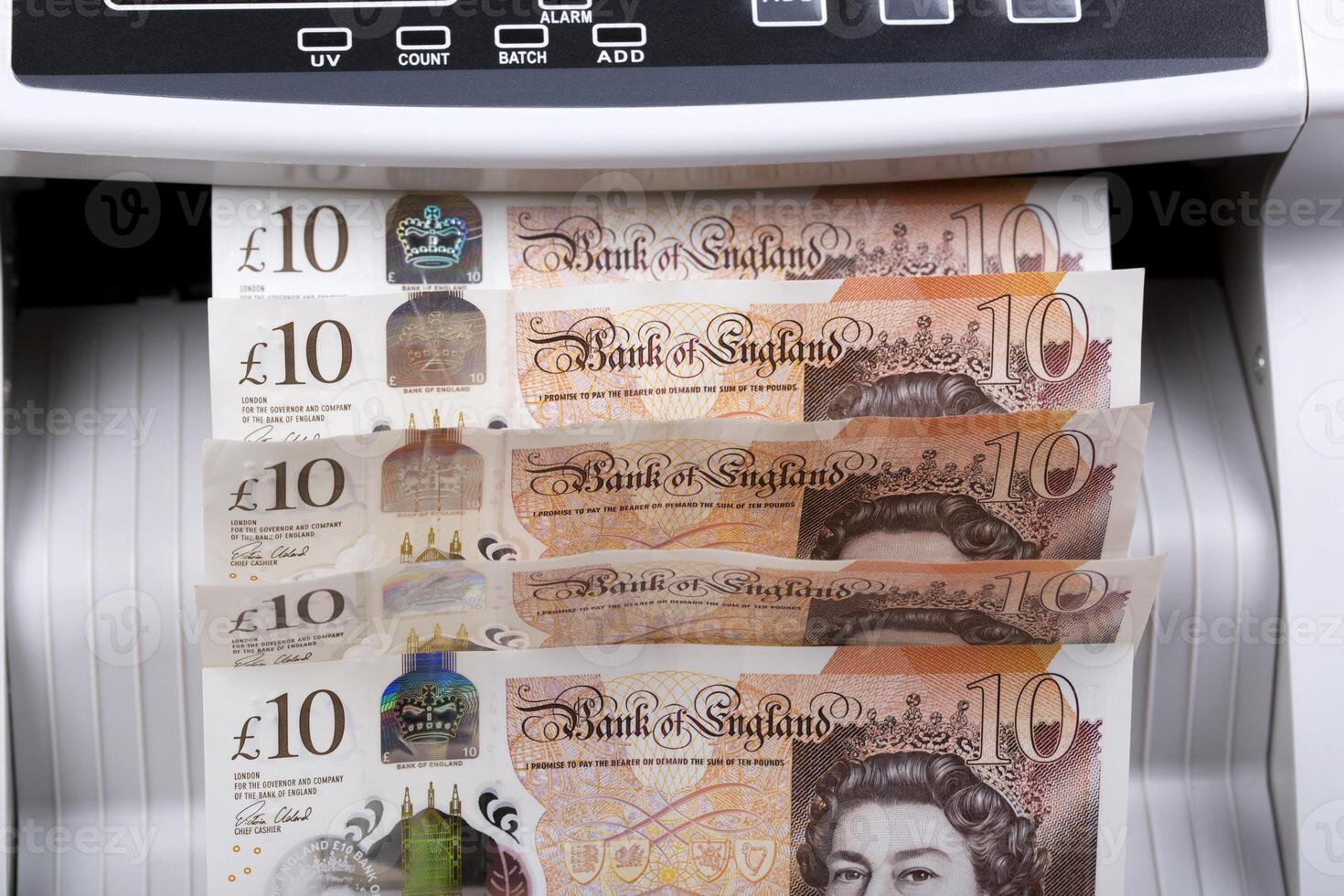 English pounds in a counting machine photo