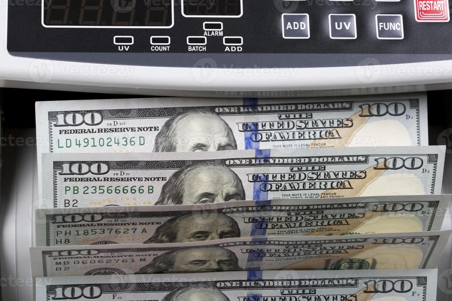 American dollars in a counting machine photo