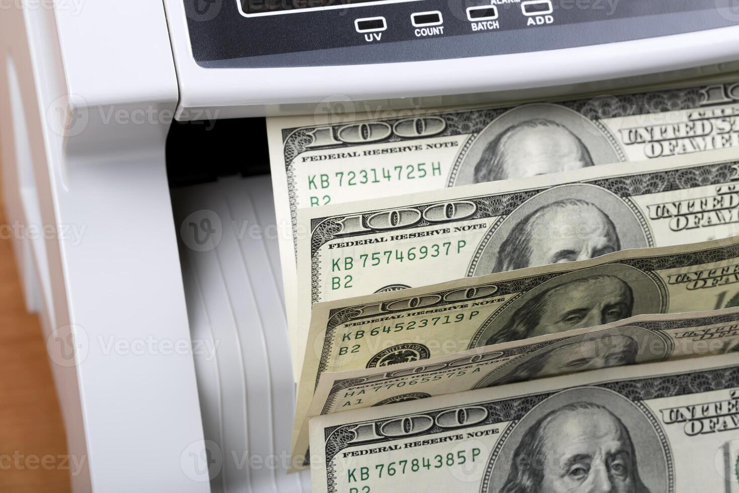 American dollars in a counting machine photo